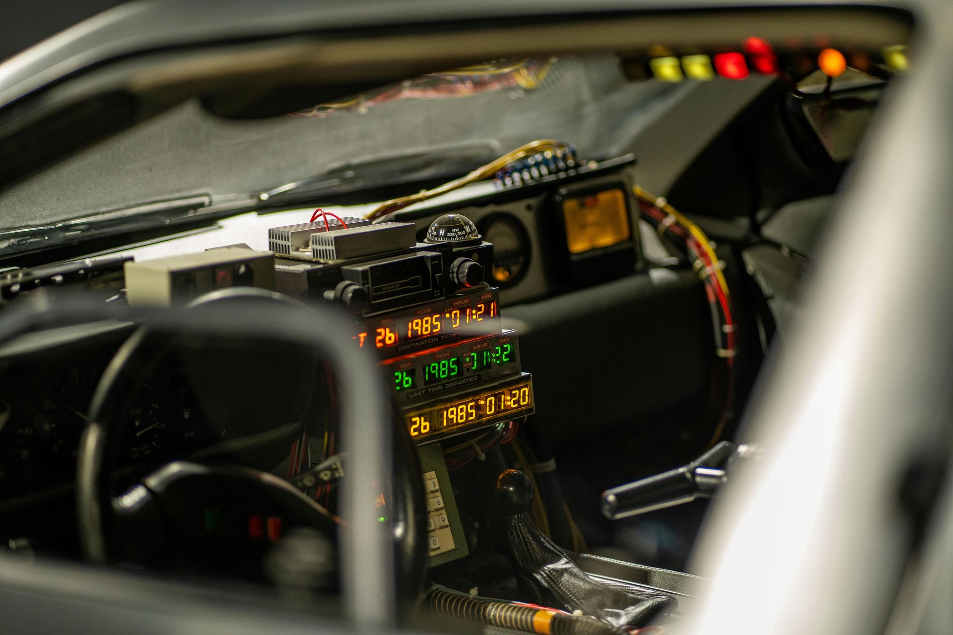 The inside of a vehicle with dates on the dashboard representing time travel