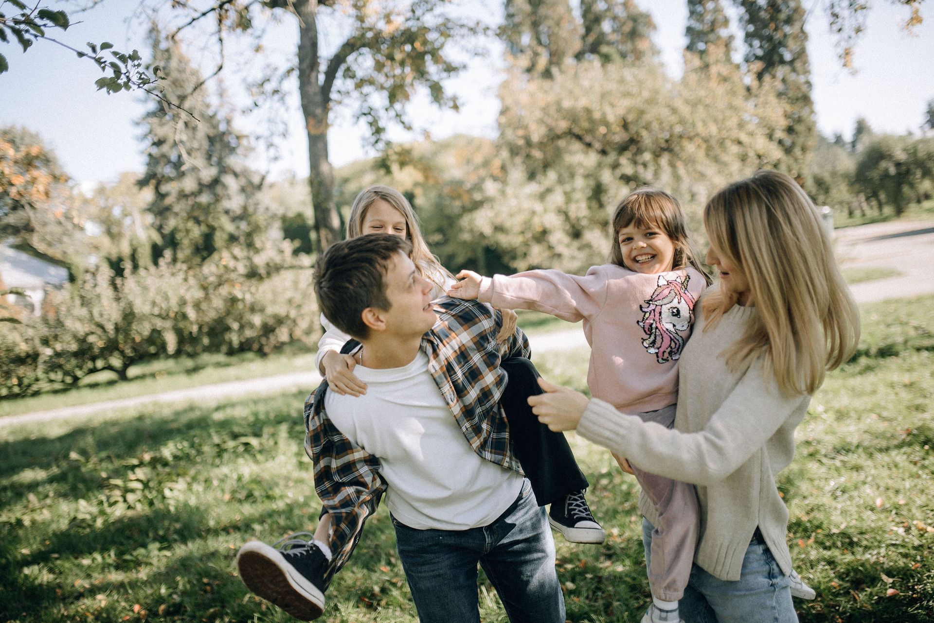 mother and father with young daughters