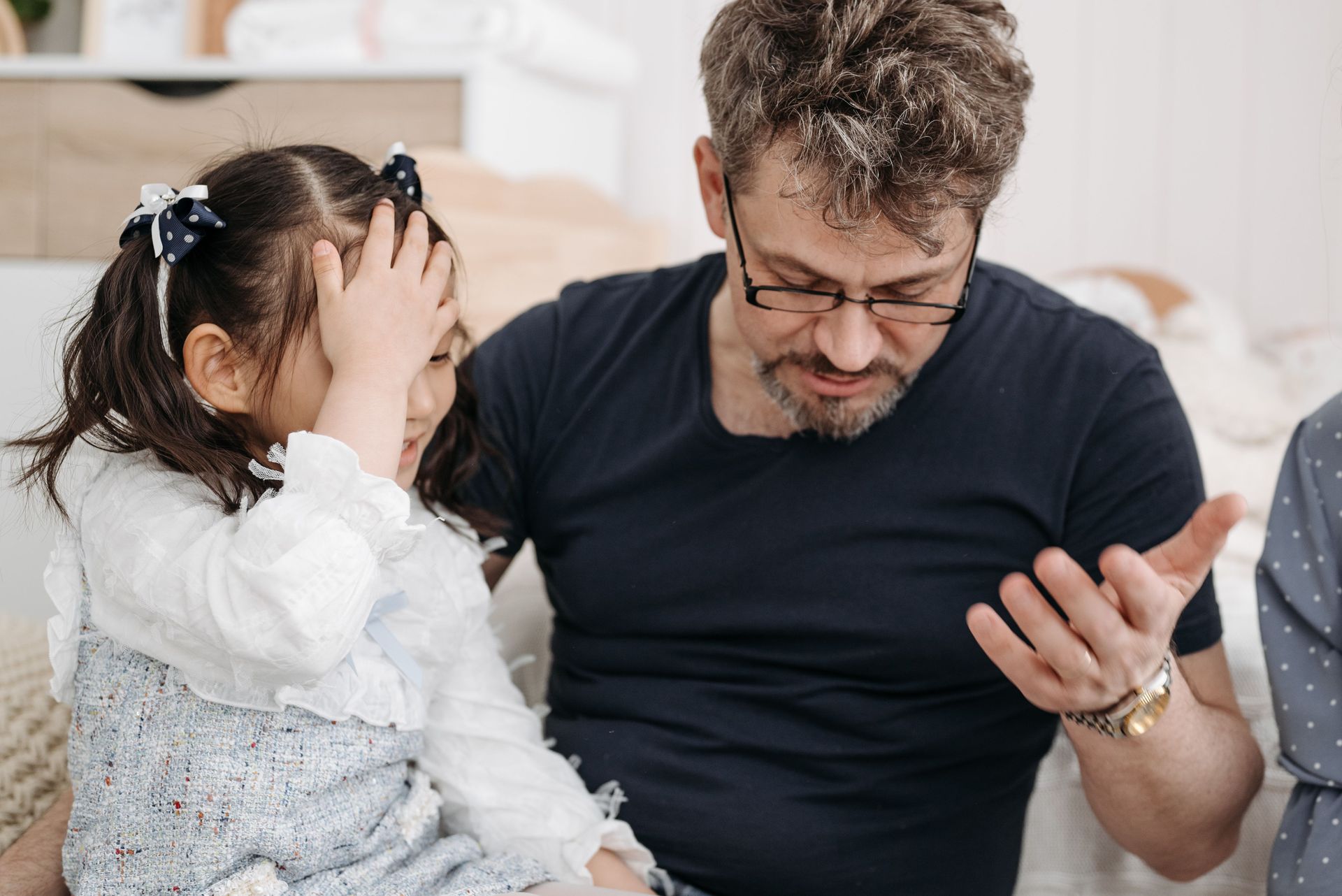 Dad talking to overwhelmed daughter, online family therapy CA