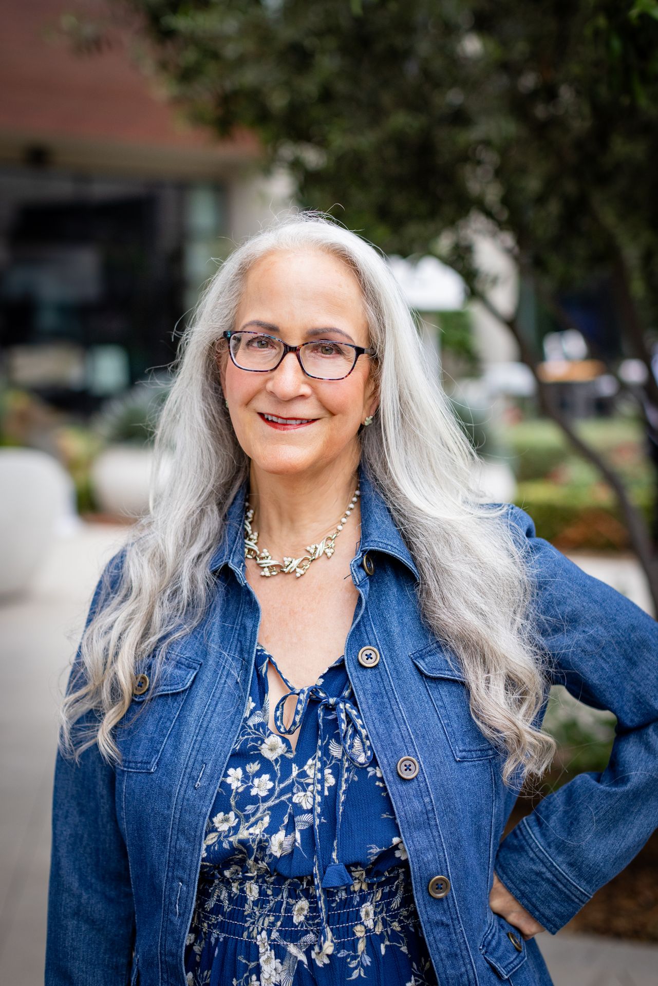 Abby McCarrel, LCSW and founder of Welcome Home Family Therapy, smiling confidently outdoors — specializing in online parent therapy in California for parents struggling with their child's anger, ADHD, autism, giftedness, and developmental trauma.