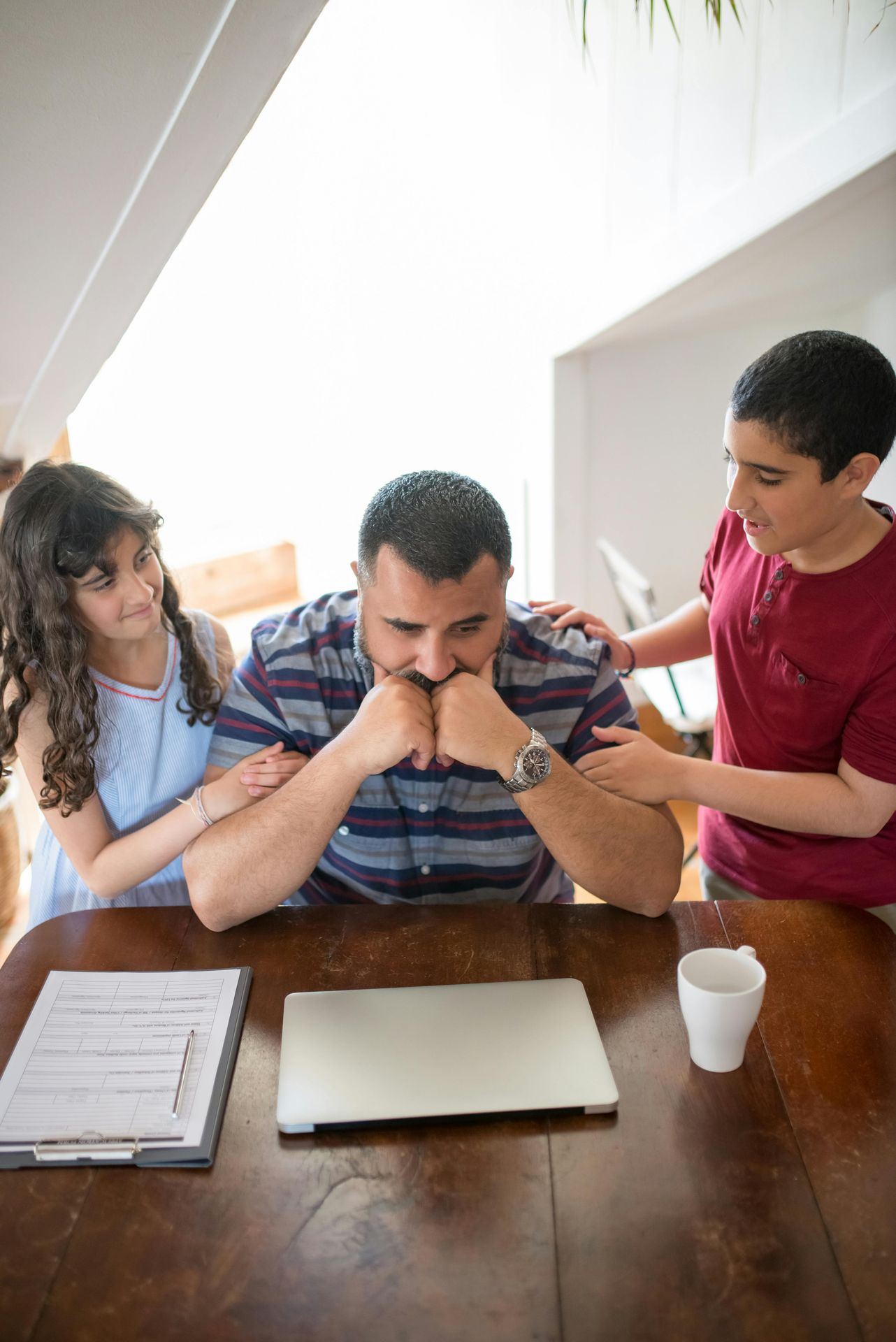 A parent sits with their child in a calm, connected moment, talking openly about feelings — representing the kind of honest, age-appropriate mental health conversations that help children feel safe and understood.