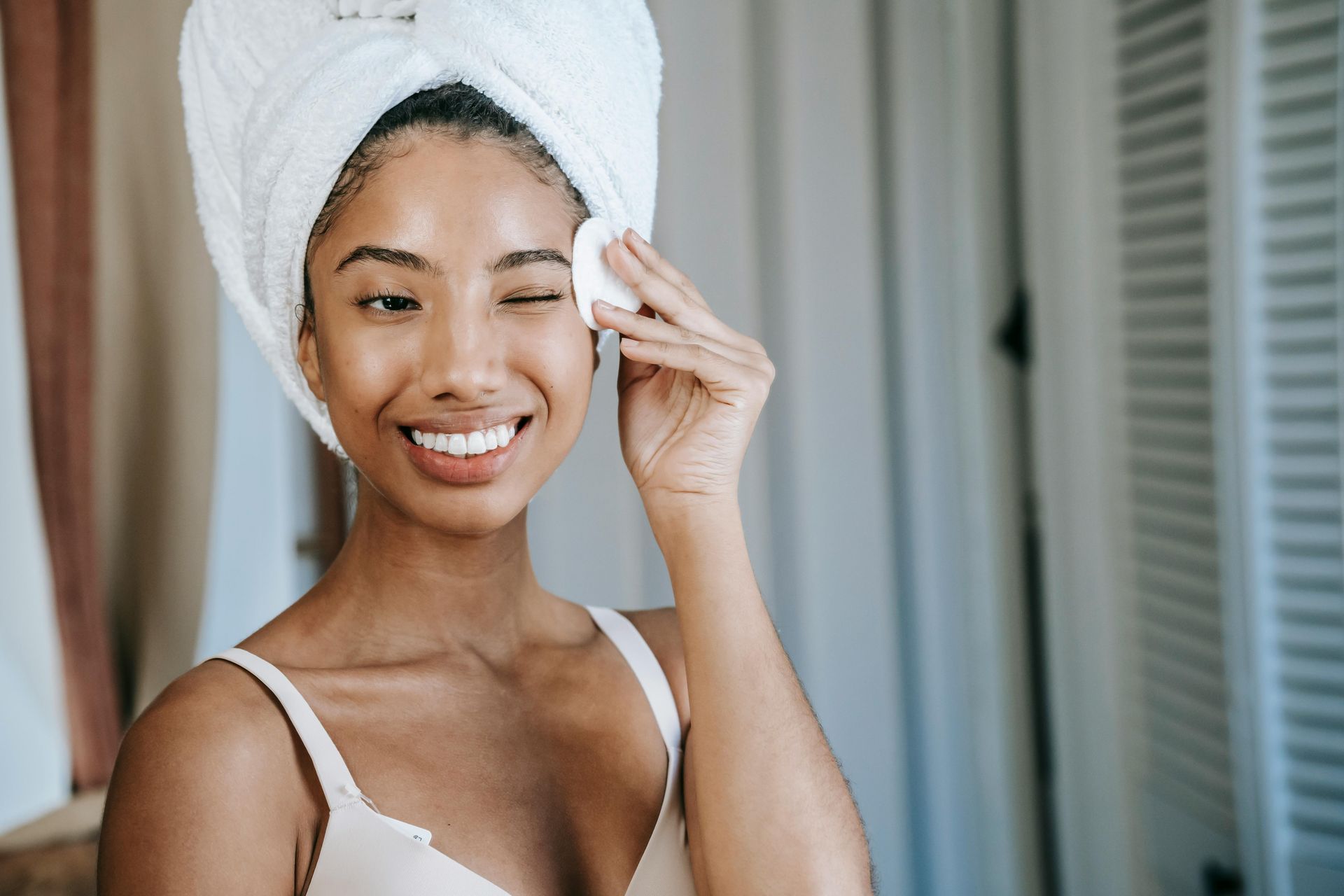 Multiracial woman cleaning her face. 17 Self-Regulation Activities for Adults Stellar Insight Counseling Online Therapist Alaska