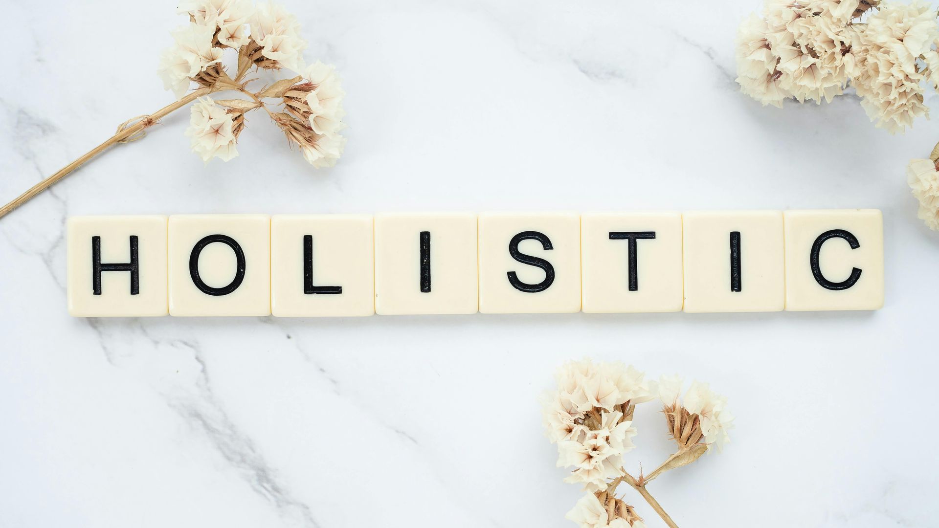 tiles spelling "Holistic." Stellar Insight Counseling Services Online Therapist Anchorage, AK
