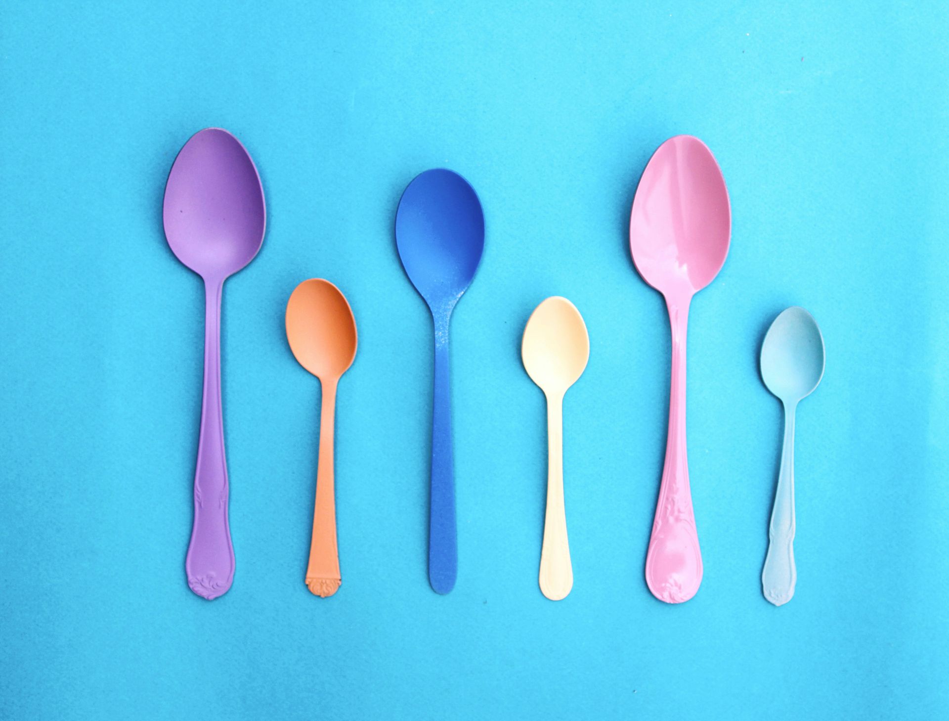 6 colorful spoons laid next to each other. Chronic Illness (Disability) and Spoon Theory | Chronic Disease & Mental Health