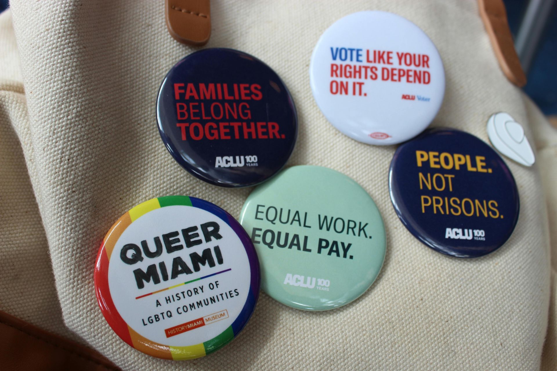 ACLU pins reading queer mami, equal work equal pay. Stellar insight counseling LGTBQ+ friendly therapy