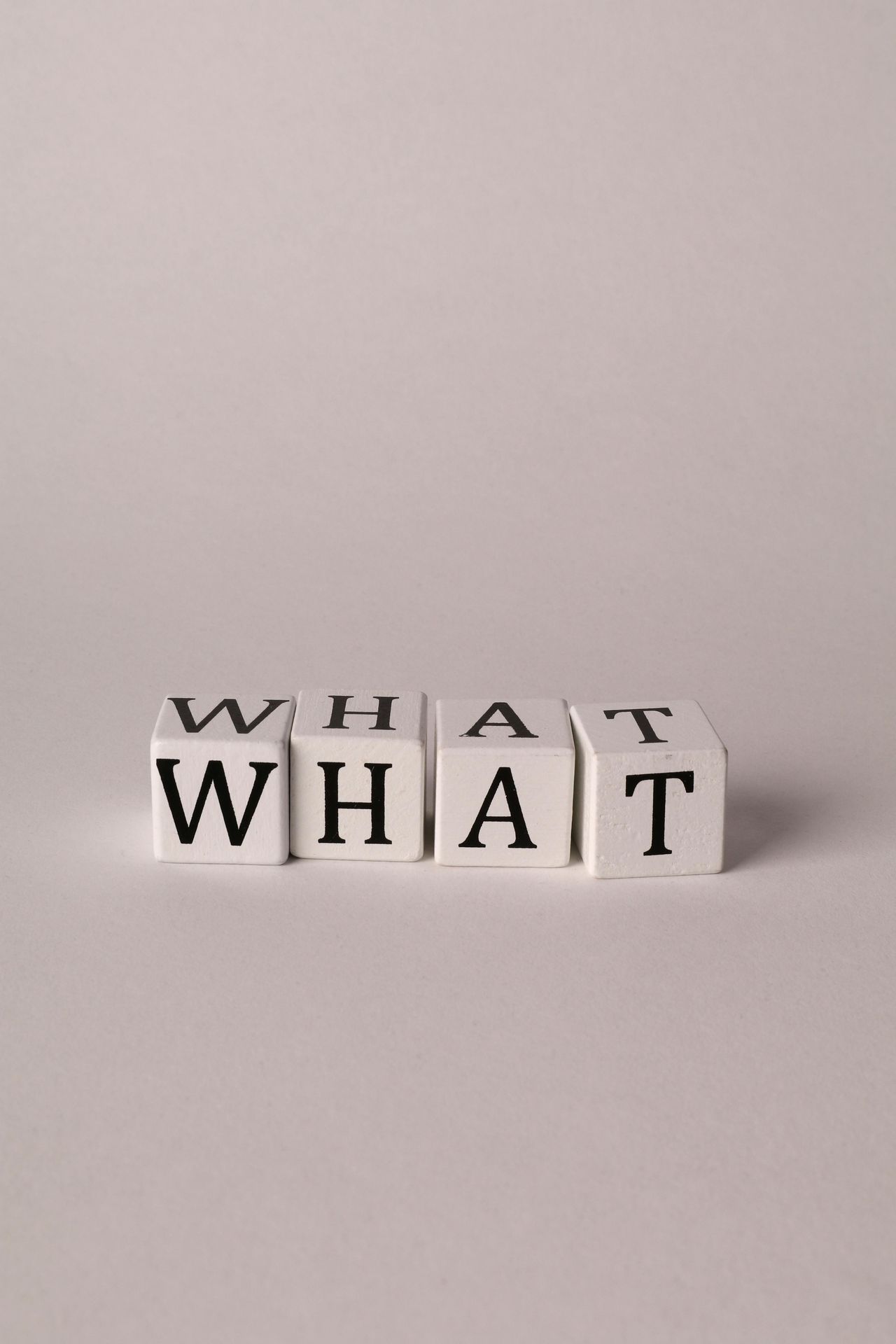 white cubes spelling "What"