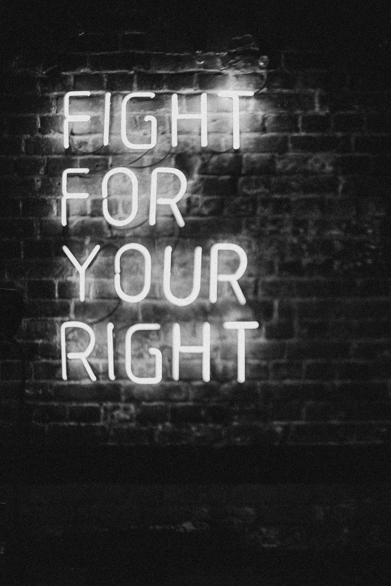 white neon lights reading "fight for your right"