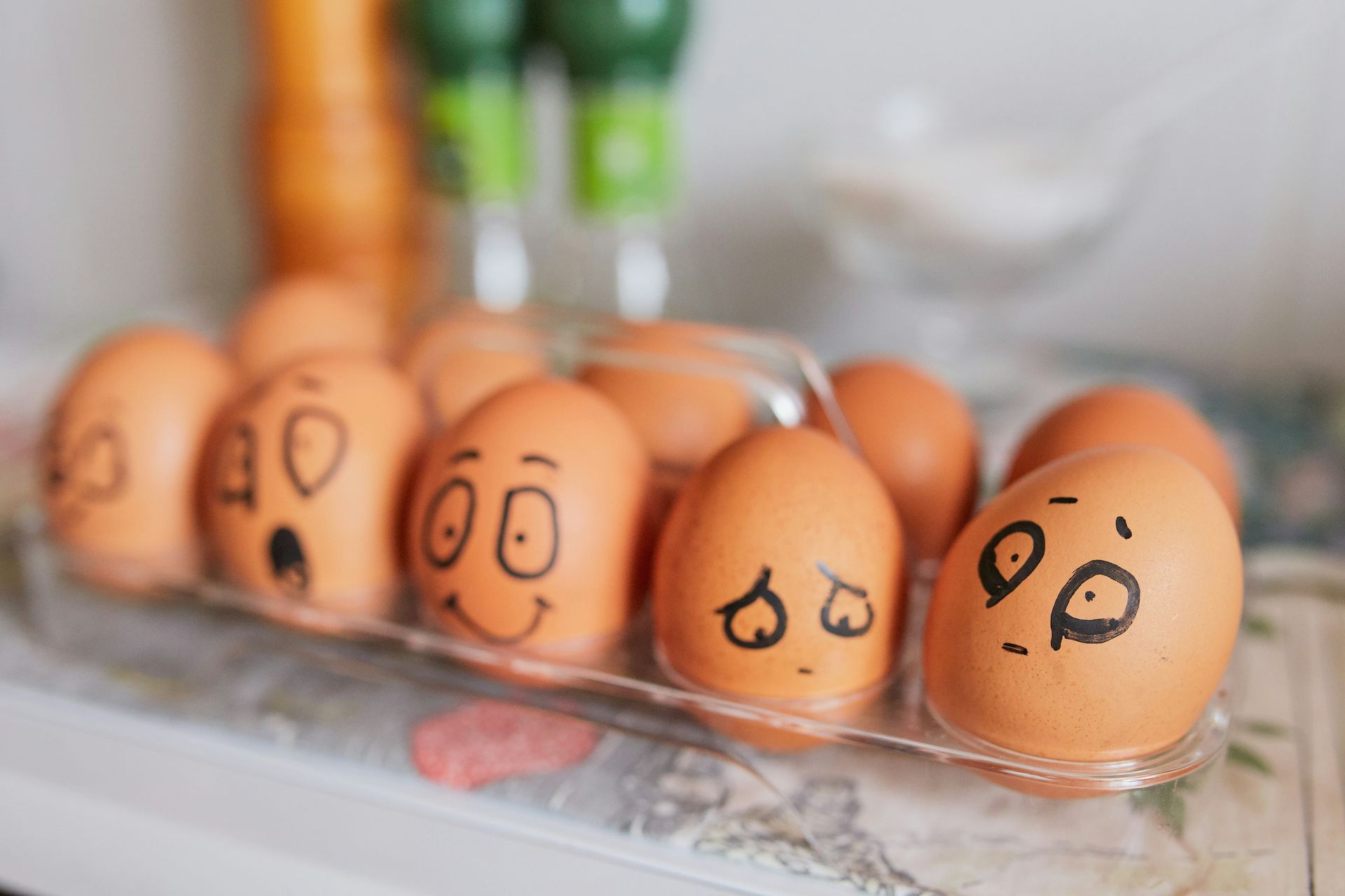 Eggs with various emotional expressions including exhausted, happy, sad, surprised. Find the right amount of sleep for your body