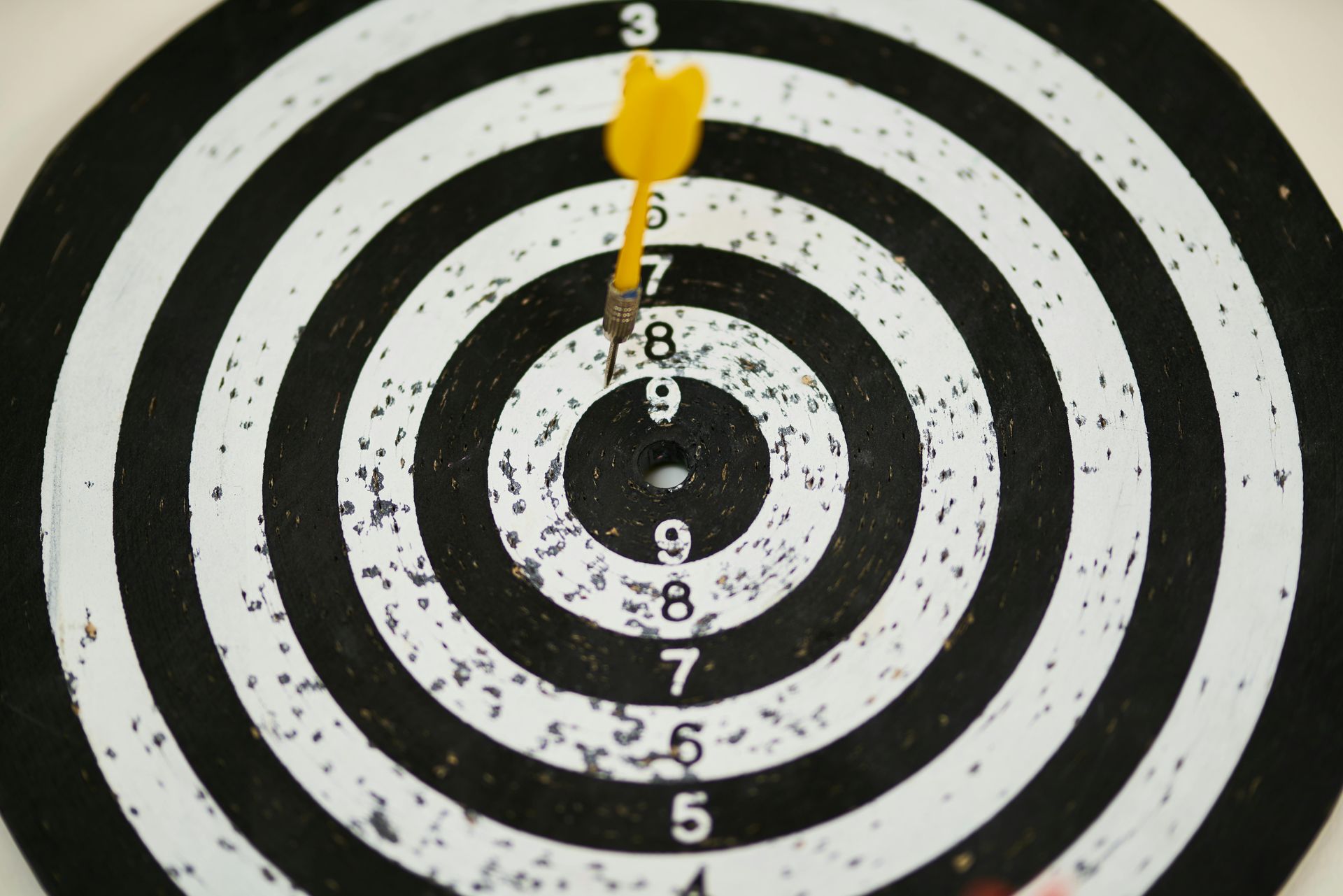 dart on dartboard How to Set Goals (& Actually Meet Them) Online Therapist Anchorage