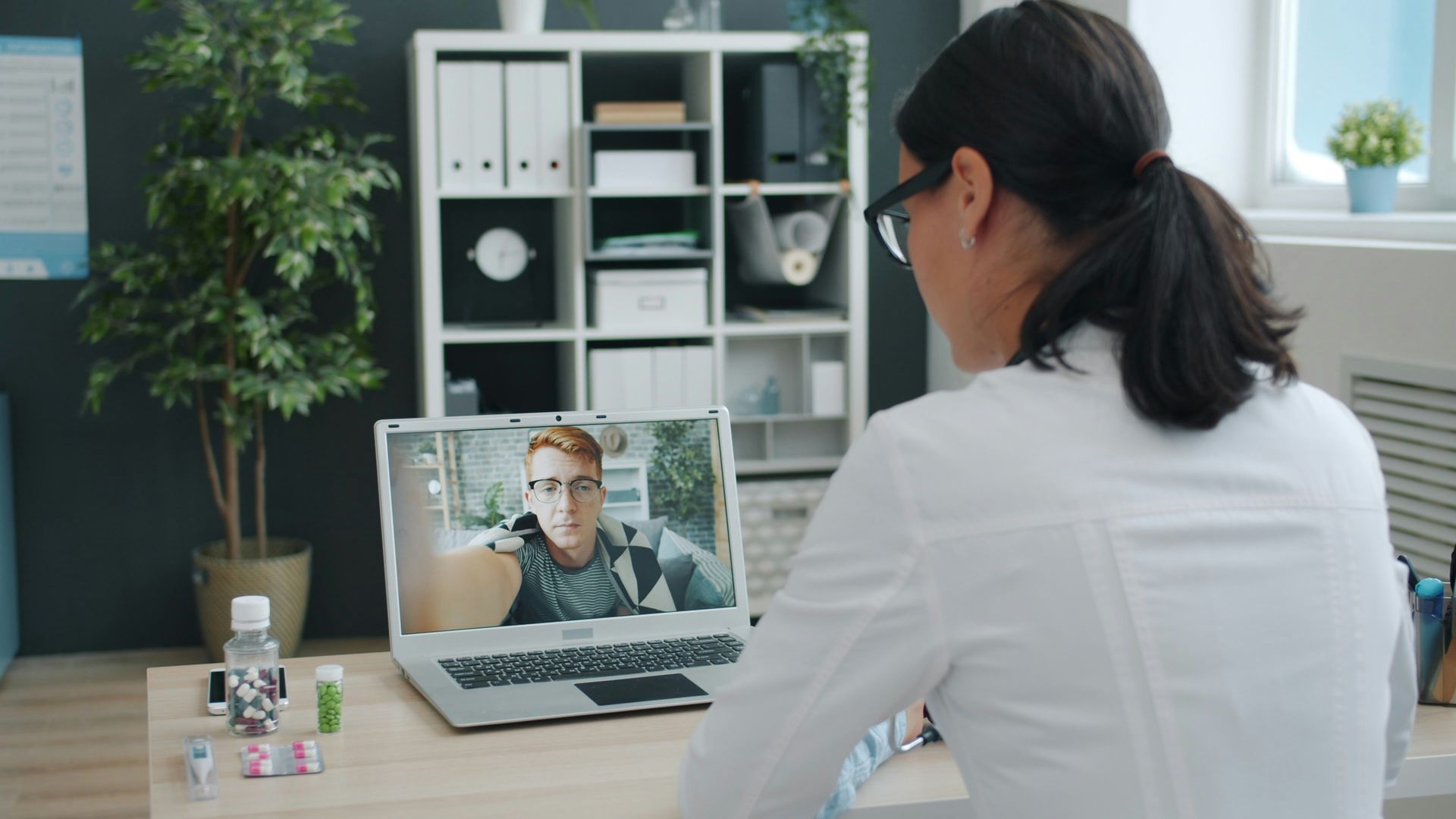 Person meeting virtually with a clinician at a behavioral health urgent care