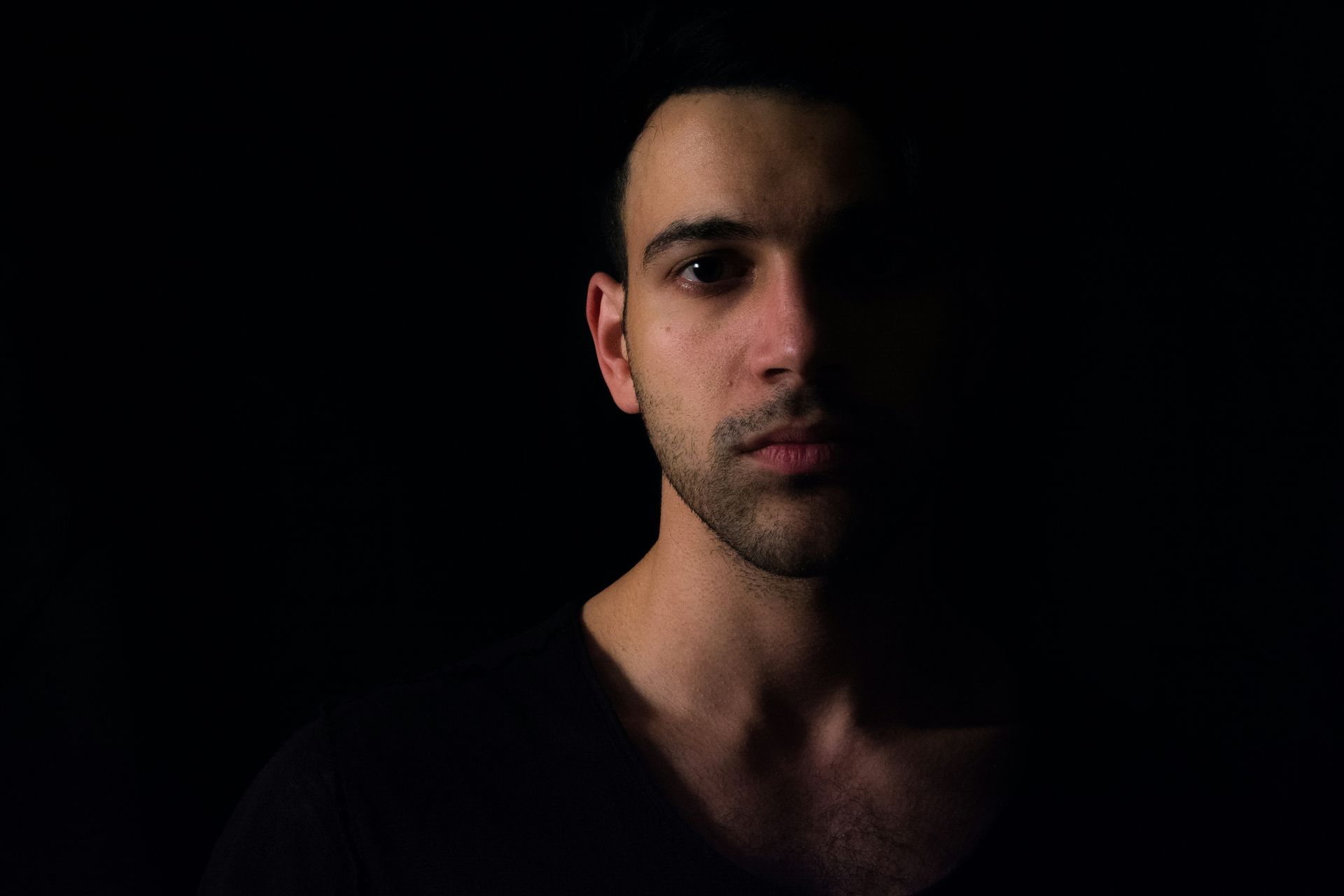 A man's face being overcasted by a shadow | grief therapy in san francisco, ca | grief therapist san Francisco, ca | grief counseling san francisco, ca | 94122 | 94539 | 94110