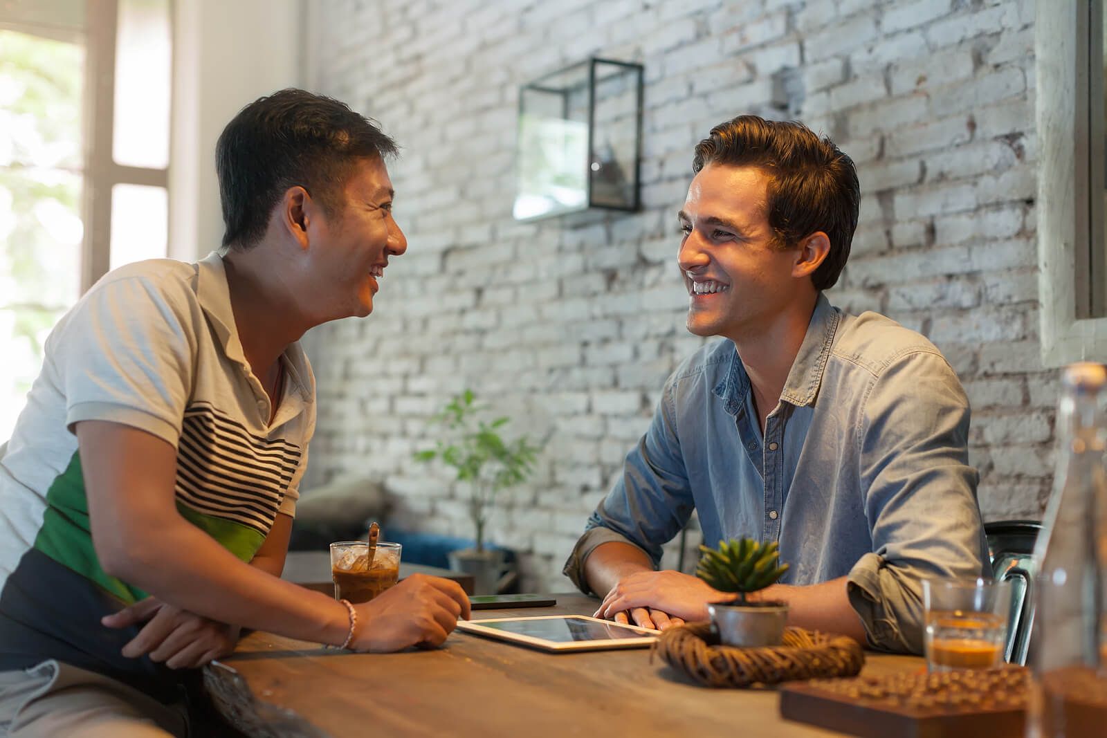 Two men having an open conversations at the kitchen table | men’s issues in san francisco, ca | counseling for men san Francisco | men's therapy san francisco, ca | 94607 | 94608 | 94609