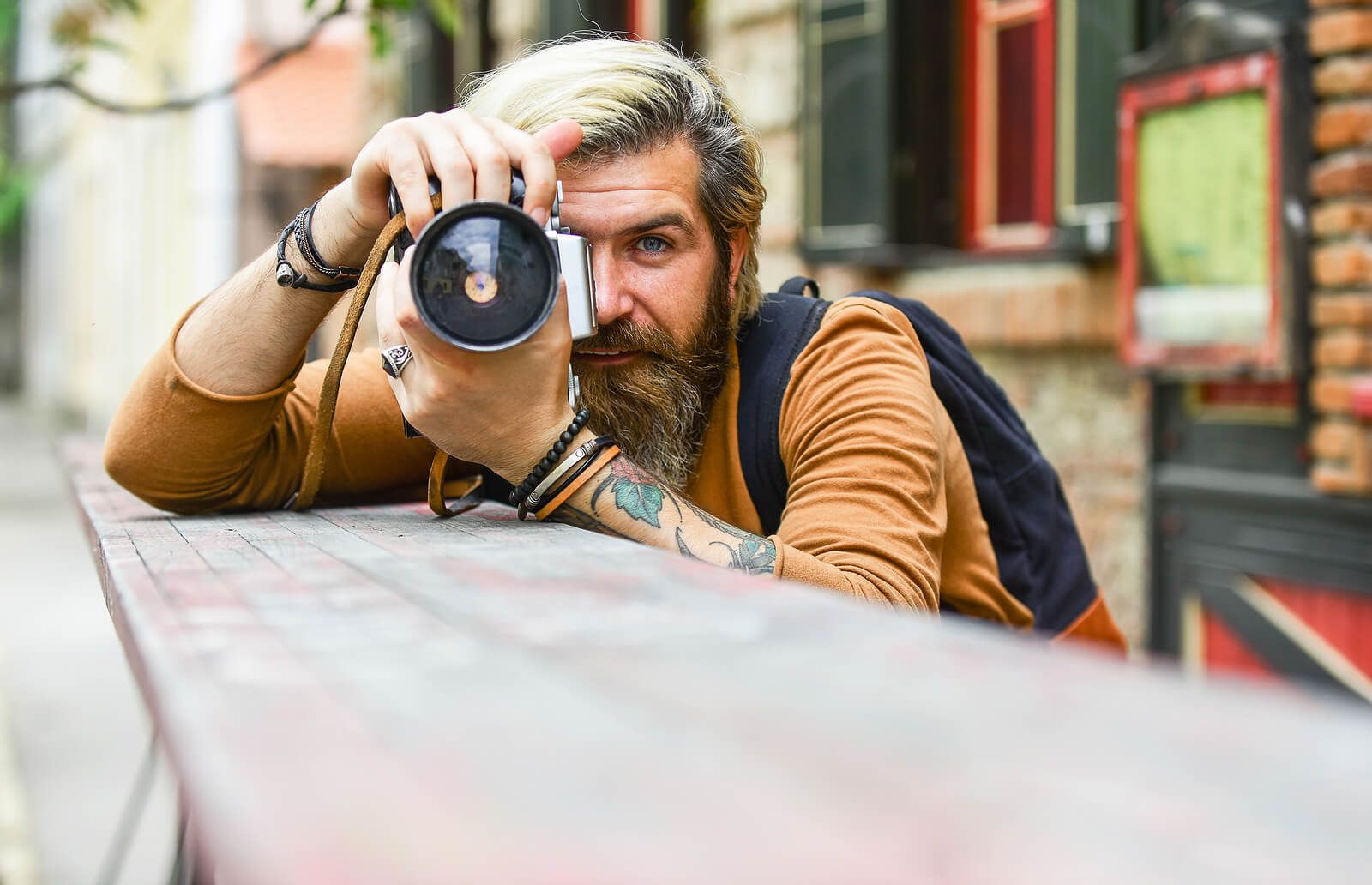 A man holding a camera up to his focus | men's counseling san francisco, ca | men's therapy san francisco, ca | online men's issues counseling california | 94117 | 94118 | 94121