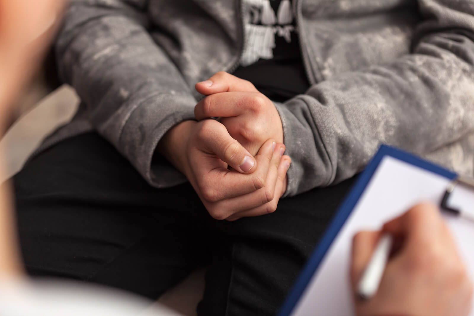 A man cracking his knuckles during grief therapy | grief therapist in san francisco, ca | grief therapy in san francisco, ca | grief counseling san francisco, ca | 94110 | 94112 | 94116