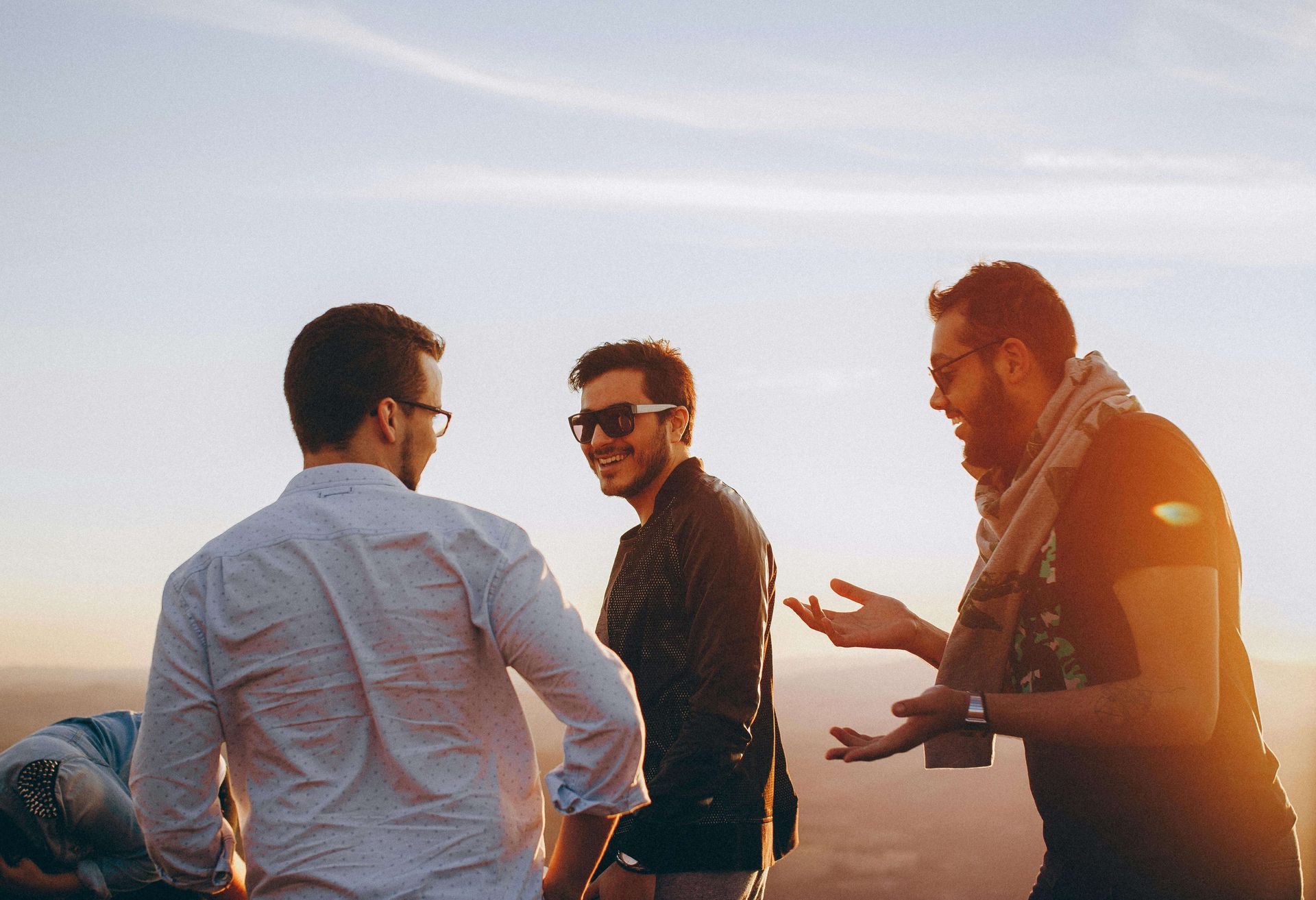 A group of men smiling at eachother | men's therapy san francisco, ca | men's counseling san francisco, ca | online men's issues counseling california | 94607 | 94608 | 94609