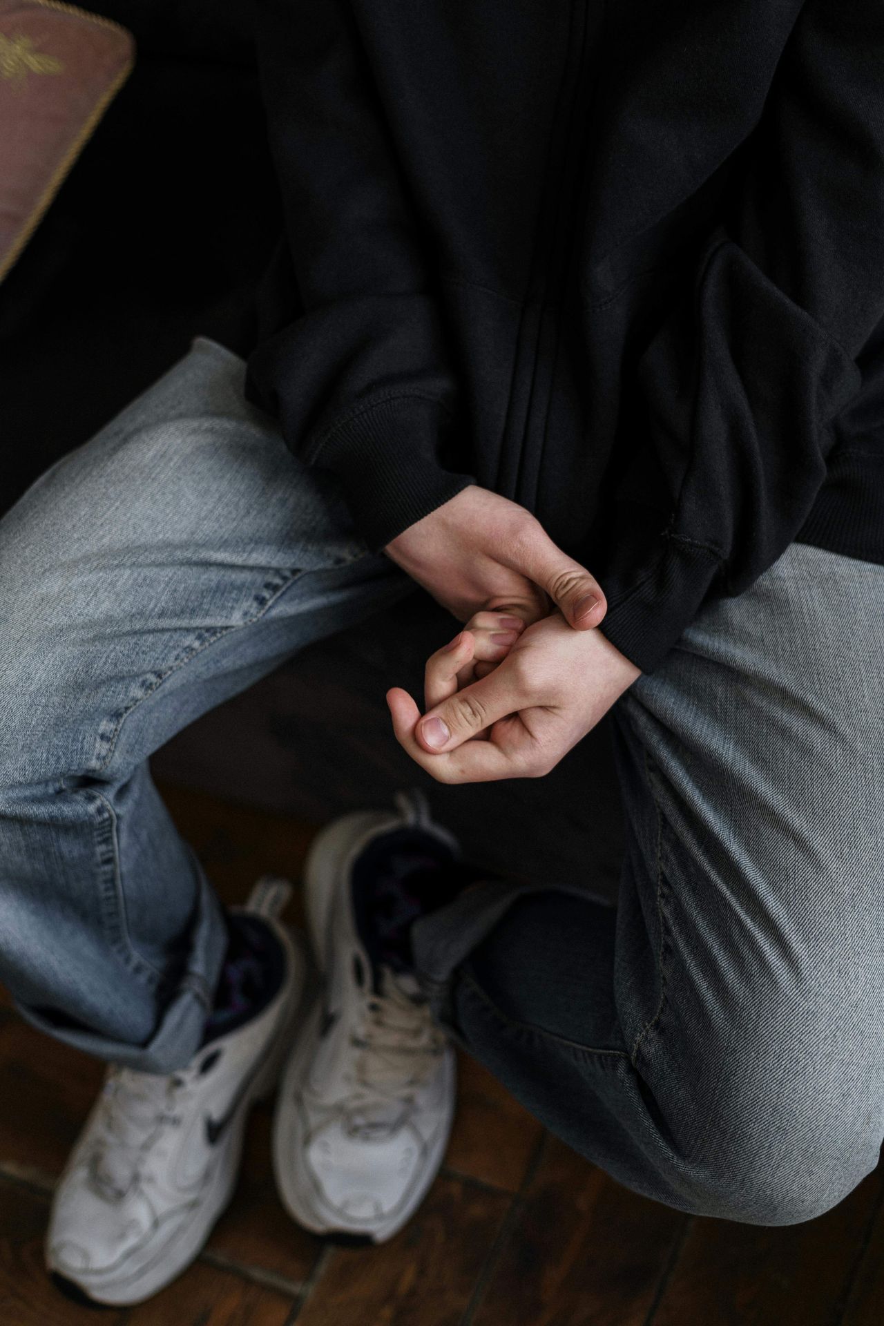 An individual wearing a black shirt, jeans & tennis shoes | men's therapy san francisco, ca | online men's issues counseling California | online men's therapy san francisco, ca | 94608 | 94609 | 94061