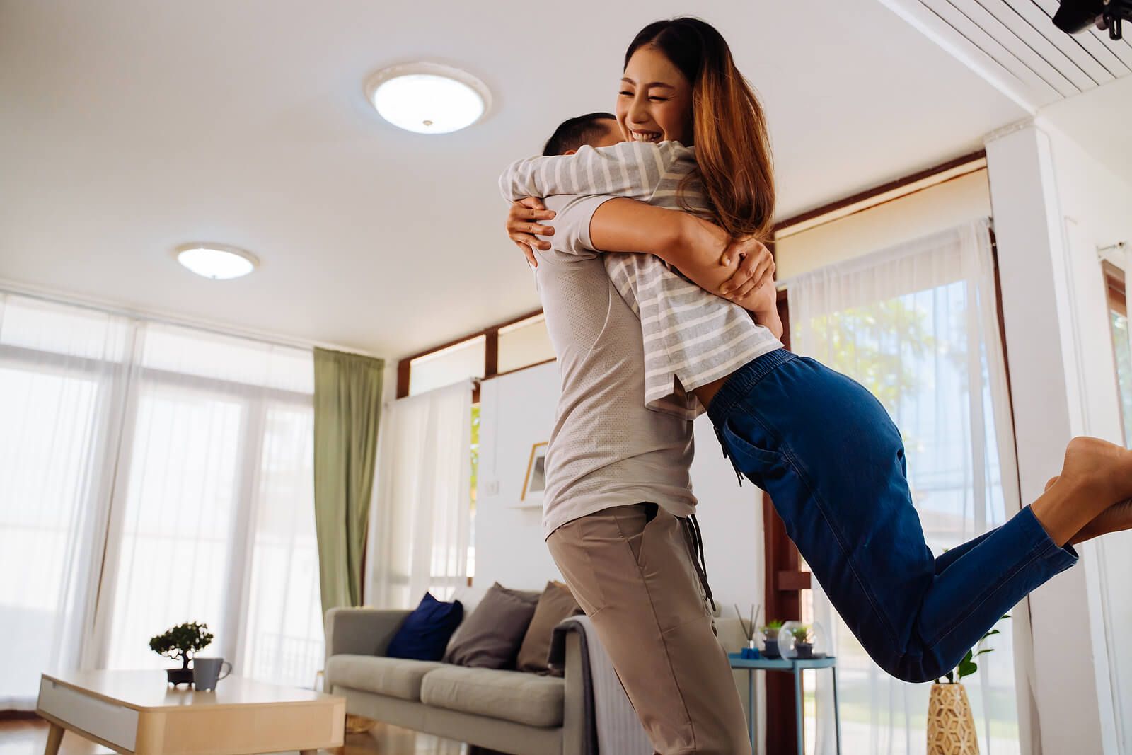 A man swinging his partner in a happy manner around the house | men’s issues in san francisco, ca | counseling for men san Francisco | men's therapy san francisco, ca | 94539 | 94110 | 94112
