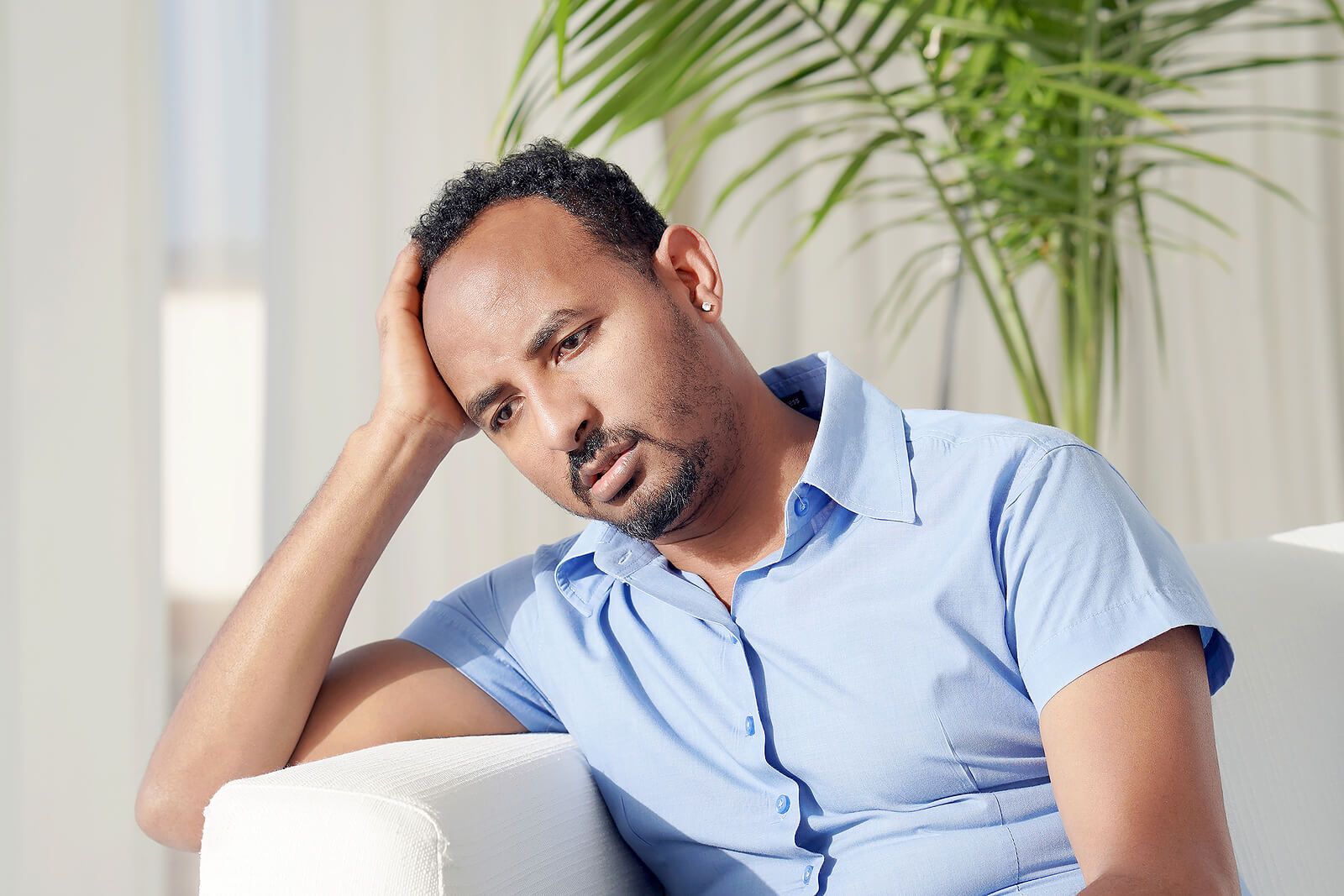 A man holding his head in his hands, showing emotions | grief therapist in san francisco, ca | grief therapy in san francisco, ca | grief counseling san francisco, ca | 94110 | 94112 | 94116
