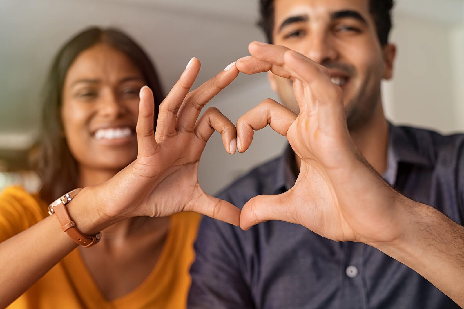 An indian couple holding their hands together to form a heart | men’s issues in san francisco, ca | counseling for men san Francisco | men's therapy san francisco, ca | 94539 | 94110 | 94112