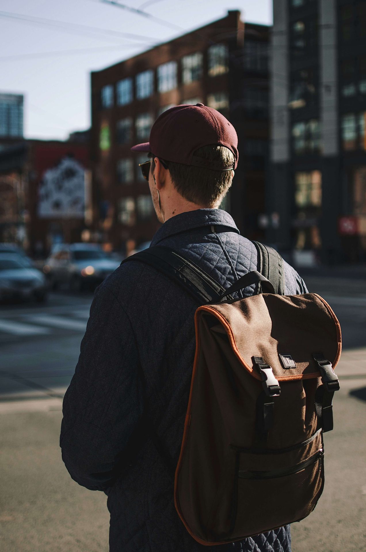 A man standing in the street in a busy city | men's counseling san francisco, ca | men's therapy san francisco, ca | online men's issues counseling california | 94110 | 94112 | 94116