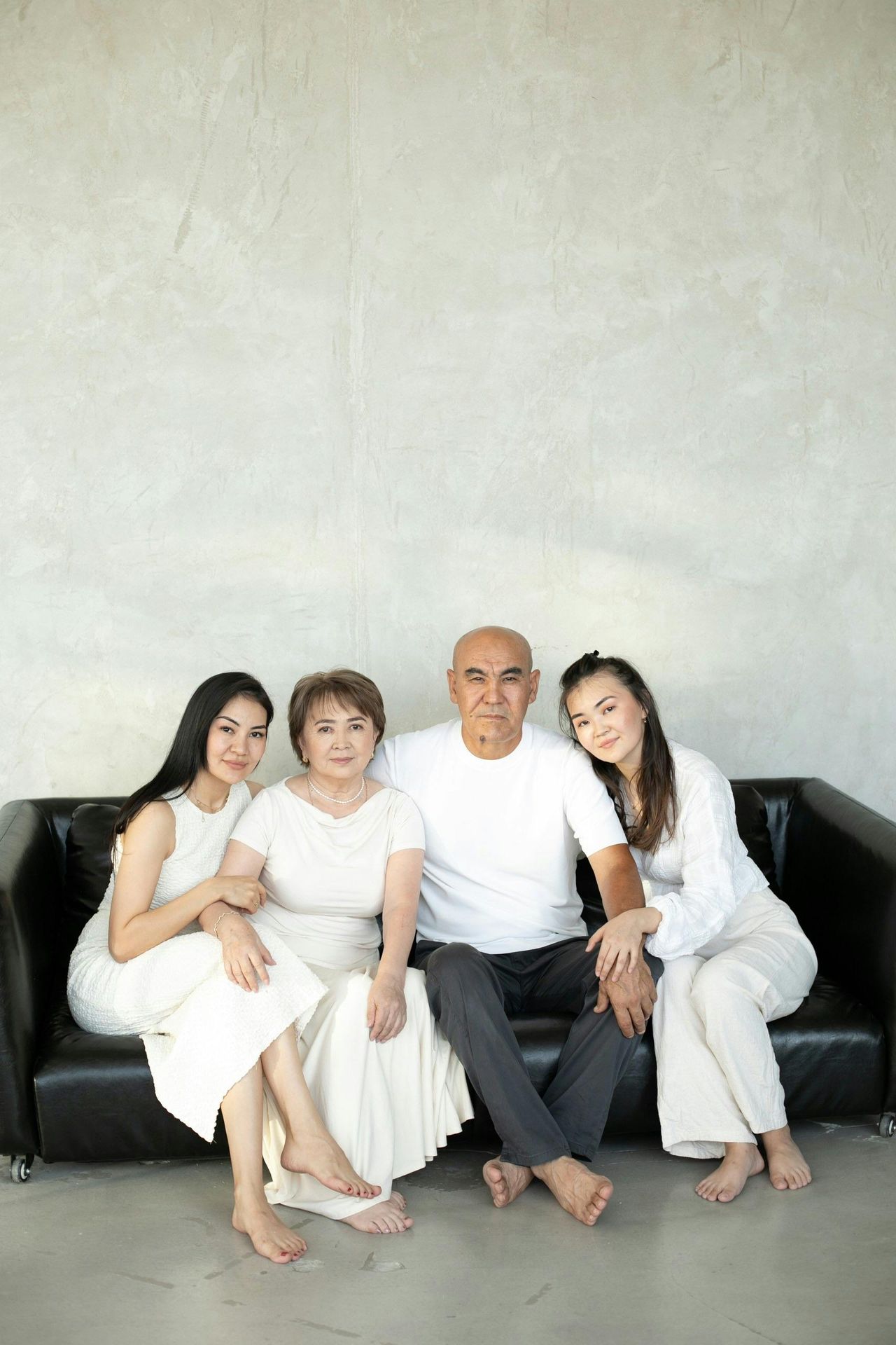 family of five of Asian decent father mother and three daughters