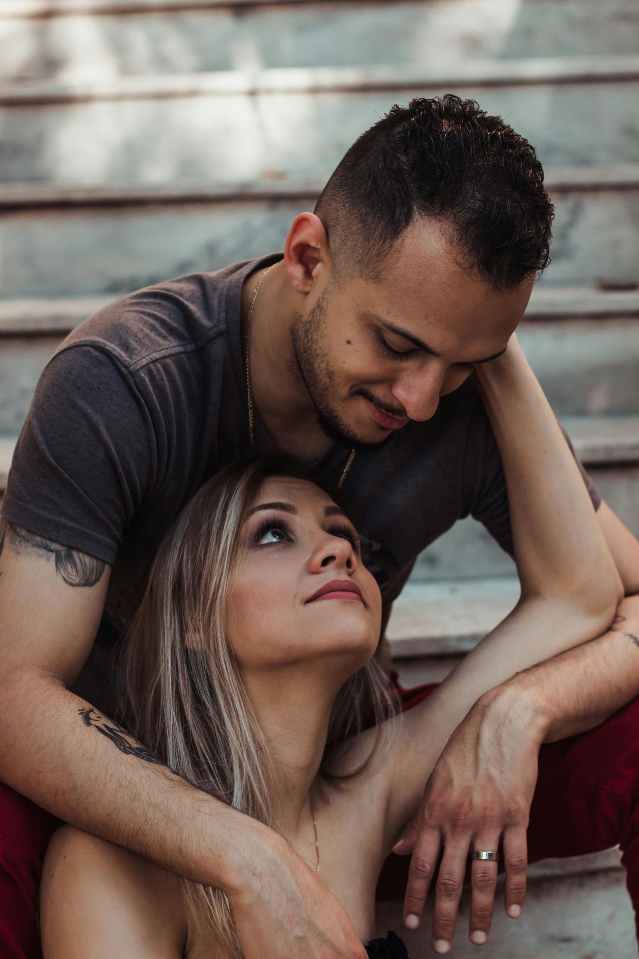 cis-gendered couples sitting and looking at each other