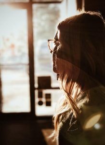 Woman looking out the door or window, Changing Negative Thinking blog, Counseling Center at Cinco Ranch, Begin therapy in Katy Texas today