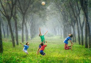 Children playing soccer in a field of trees, How to Counteract Negative Thinking Errors in Children blog, the counseling center at cinco ranch, katy texas 77494