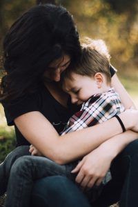 A mom holding her son. Represents the need for parenting therapy in Katy, TX 77494