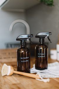 cleaning products on table to help declutter your home and help with stress relief and reduce anxiety