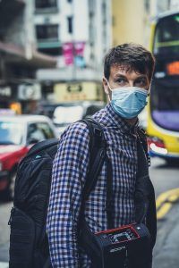 Man on road wearing mask