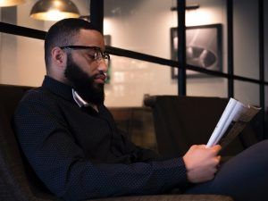 A man that has experienced PTSD that has tidied up his workspace to help ease anxiety symptoms