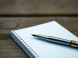 A journal and pen for a teenage boy to write his thoughts during a therapy session in Katy, TX 77494