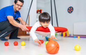 Occupational therapy treatment session on screening development of kids. Concept for pediatric clinic, pediatrician and learning. Early signs for autism in children can include delayed milestones, limited social interactions with peers, and repetitive actions or fixations. Early signs of Autism blog. Therapy in Katy Texas. Counseling Center at Cinco Ranch.