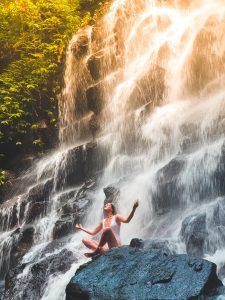 woman meditating by a waterfall, mindfullness meditation blog, reduce anxiety, counseling center at cinco ranch, katy texas