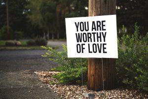 A sign that says you are worthy of love. Represents the need for self-compassion counseling in Katy, TX 77494