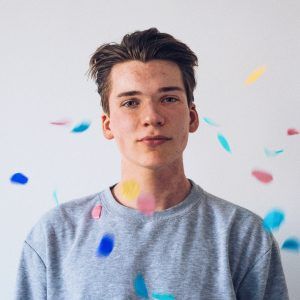 A teen boy attending a party with his friends. Developing friends was part of his mental health toolkit he learned in teen group therapy in Katy, TX 77494
