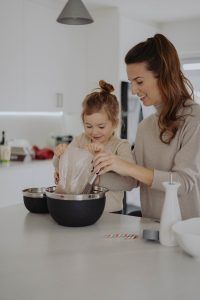 a mom baking with her daughter, How to help your child cope with separation anxiety blog, Counseling center at cinco ranch, begin counseling in katy texas, fulshear texas, richmond texas