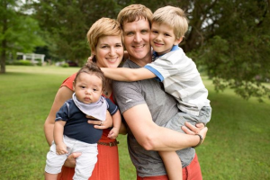 Family smiling taking a group picture, adoption counseling blog, counseling center at cinco ranch, katy texas