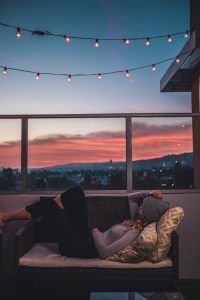 A woman relaxing on her patio where she created her safe space