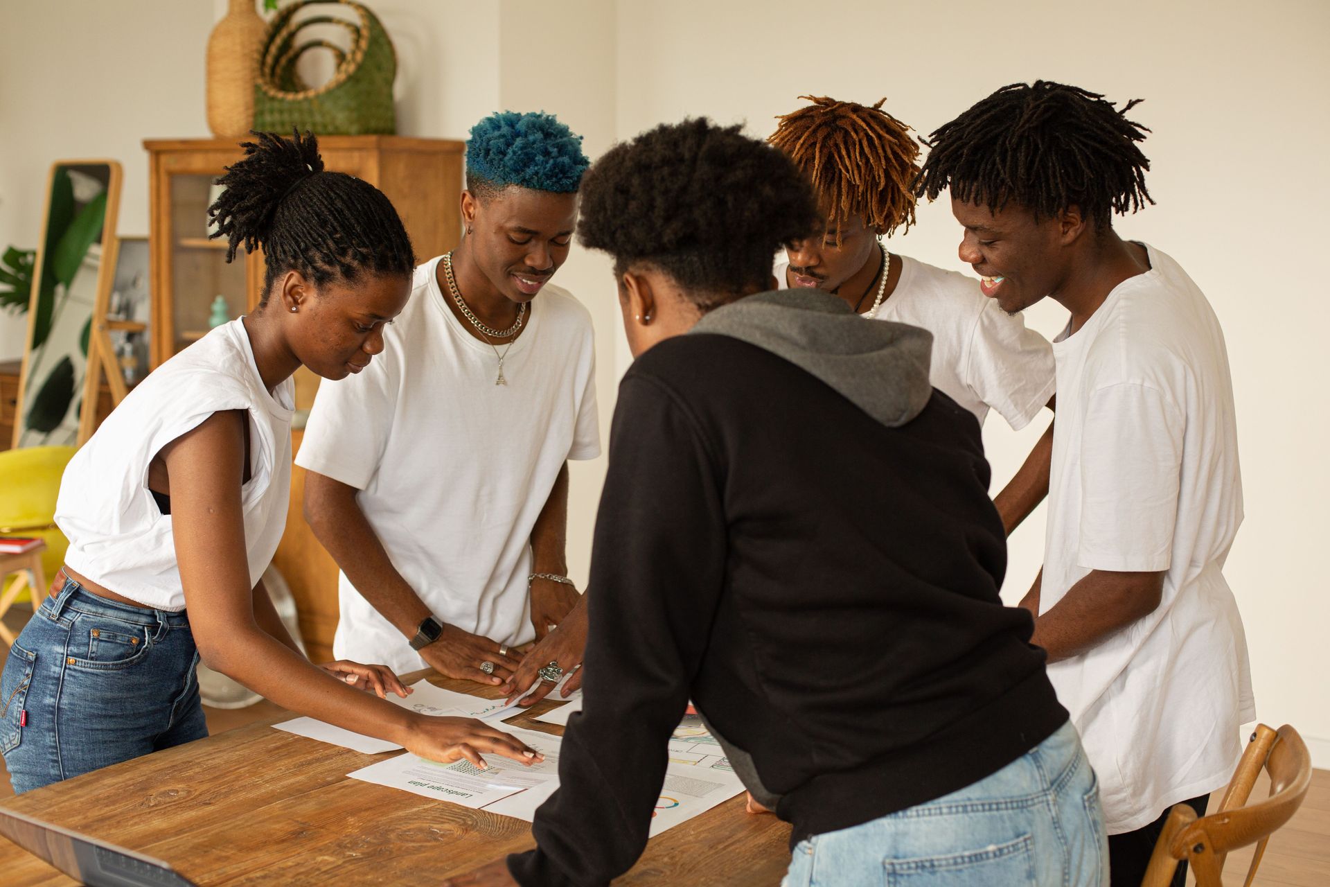 A group of adults working together around a table