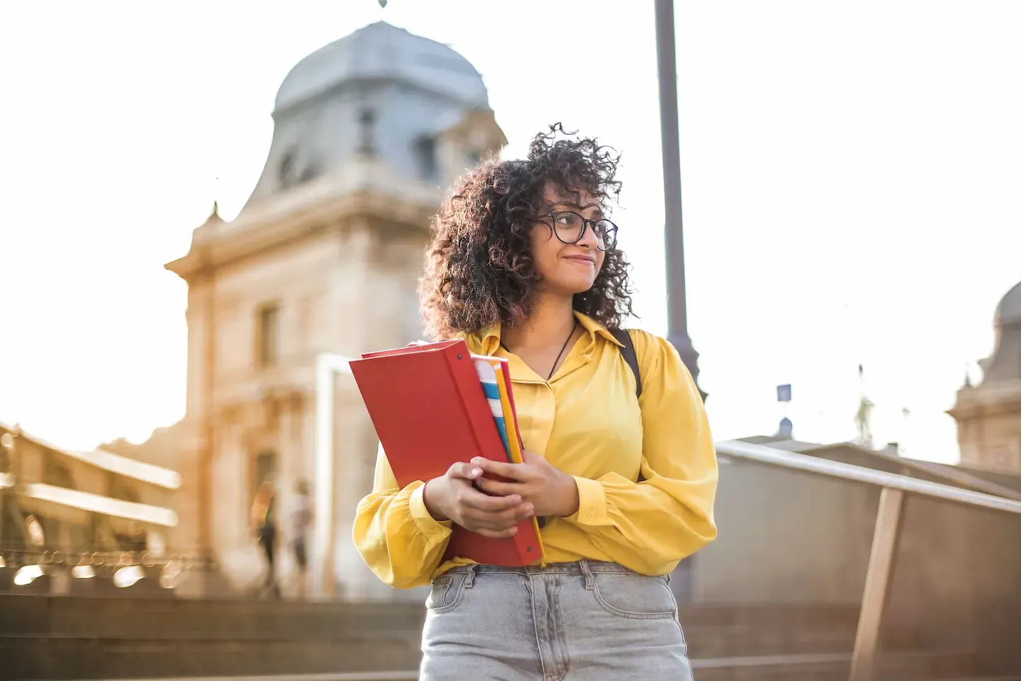 Young Adult holding a folder.