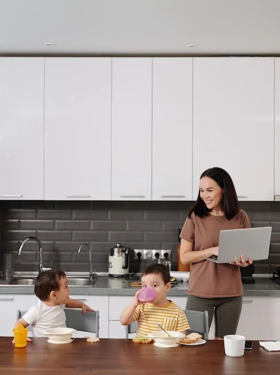 Mother with 2 boys in the kitchen.