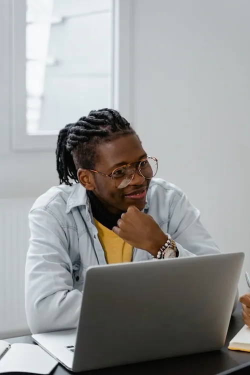 Guy talking to a laptop.