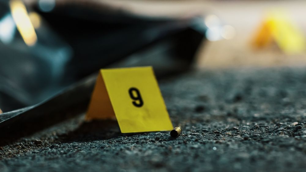 A close-up of a bullet casing and crime scene marker illustrates the impact of violence and trauma. Survivors often seek support through EMDR therapy in Palm Beach, FL to process these events. Options such as EMDR therapy in Palm Beach County, FL or an EMDR intensive Delray Beach, FL program can provide effective healing pathways.