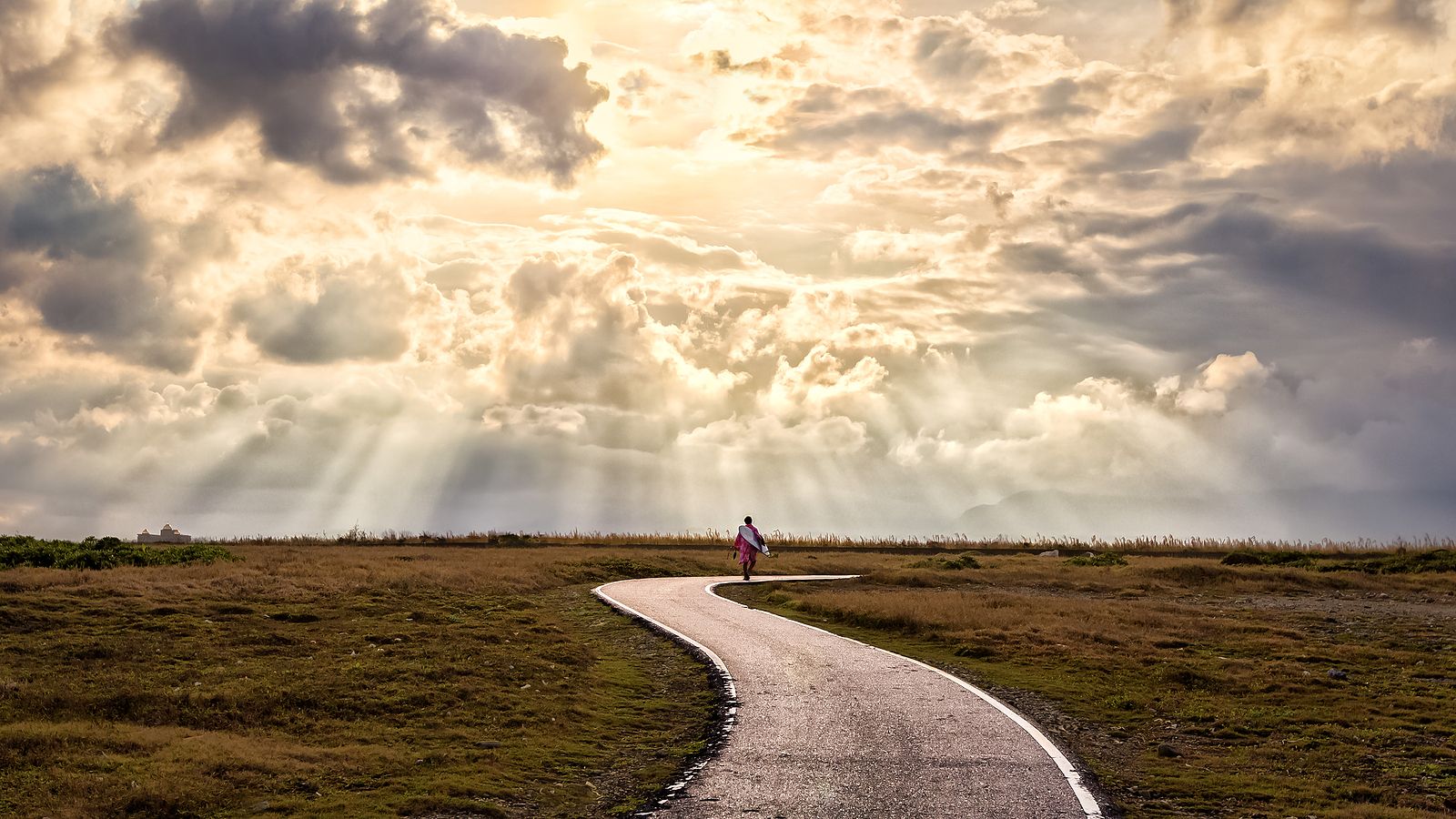 A person walking along a peaceful path symbolizing a healing journey through EMDR therapy in Boca Raton, FL. Learn more about how EMDR group therapy in Palm Beach County, FL can offer support by contacting an EMDR therapist in Palm Beach County, FL today. 33431 | 33432 | 33486