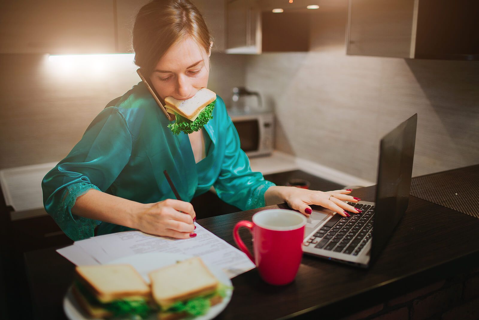 A woman juggles a phone call, a sandwich, and her laptop at once, a vivid picture of the overload that often comes from feeling responsible for everything. Emdr in Palm Beach County, FL, trauma treatment in Palm Beach County, FL, and emdr therapy in Boca Raton, FL can help ease this pattern.