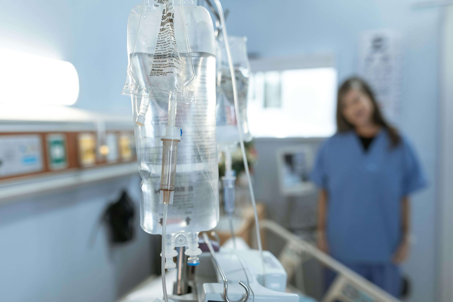 An IV bag hangs in a hospital room, representing the medical and emotional struggles often tied to trauma. Individuals seeking EMDR in Palm Beach County, FL can begin recovery with supportive care. Many benefit from EMDR group therapy in Palm Beach County, FL or personalized sessions such as EMDR therapy in Palm Beach, FL.