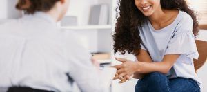 A person holding a clipboard takes notes across from a smiling woman. This could represent the support a PCIT therapist in Tampa, FL can offer. Learn more about PCIT in St. Pete, FL and the other services we offer. Learn more about PCIT in St. Petersburg today.