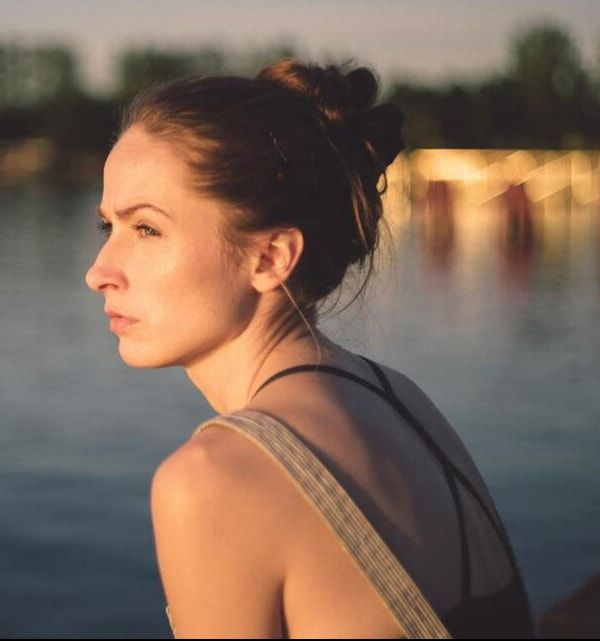 Photo of a woman looking off in the distance. This photo represents someone with depression needing counseling for their mood disorder in Florida
